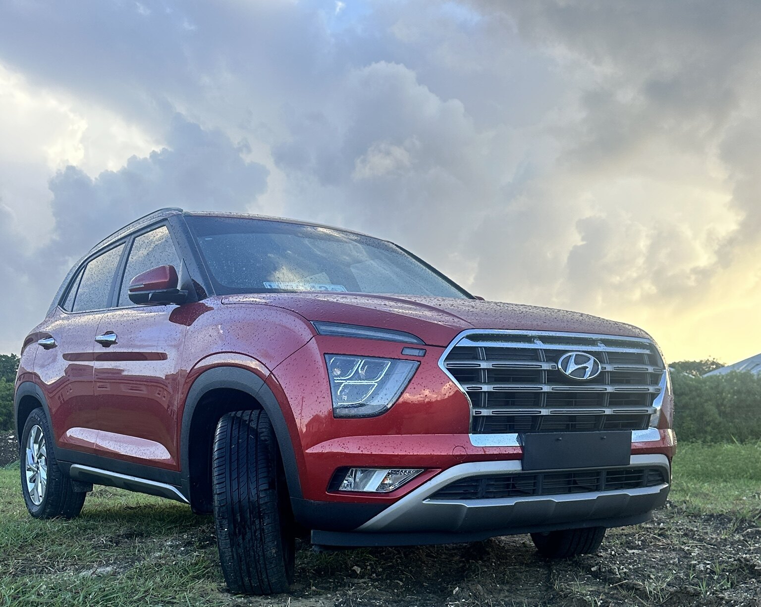 Low-angle front exterior view of the red Hyundai Creta