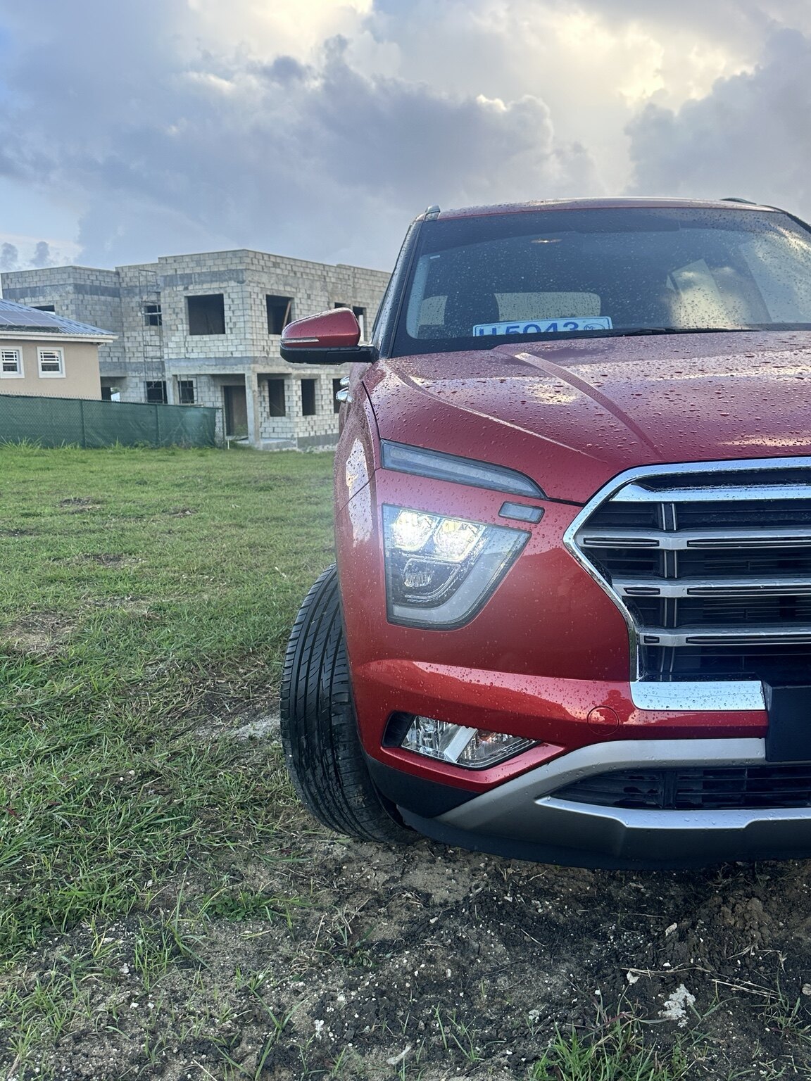 Front detail view of the red Hyundai Creta after rainfall