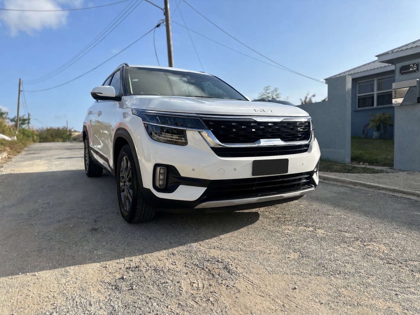 Actual white Kia Seltos from the 360 Car Rentals fleet