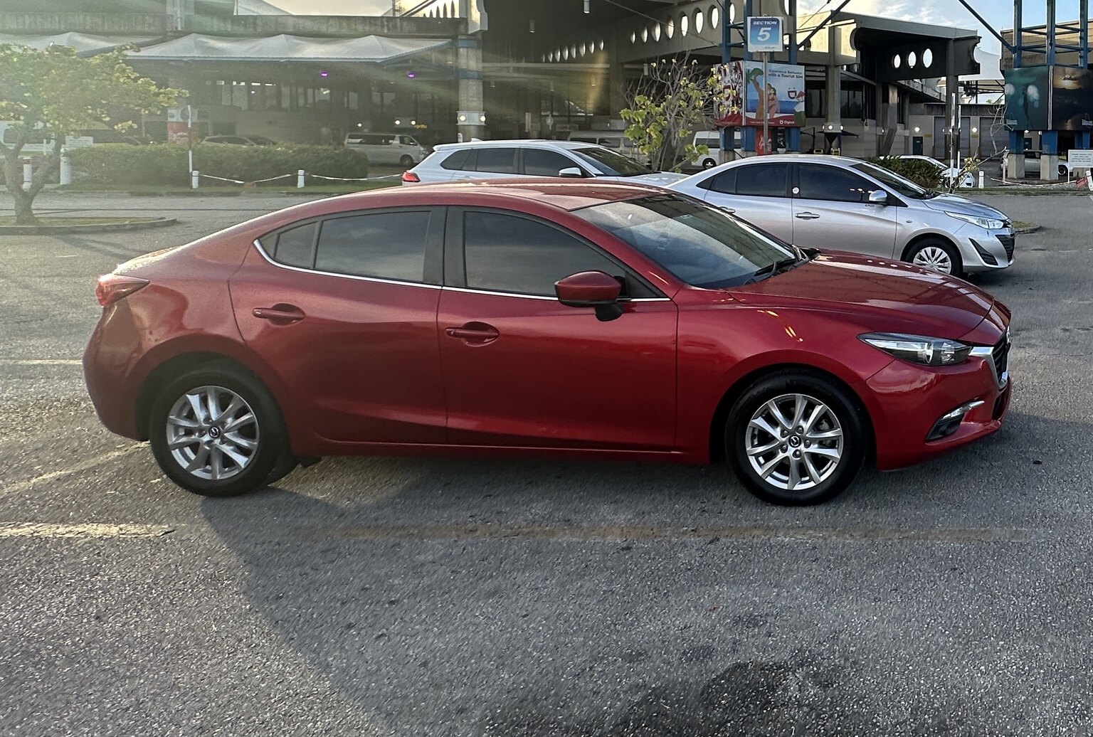 Actual red Mazda 3 from the 360 Car Rentals fleet
