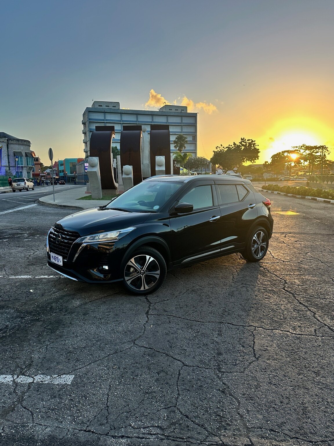 Black Nissan Kicks exterior view at sunset