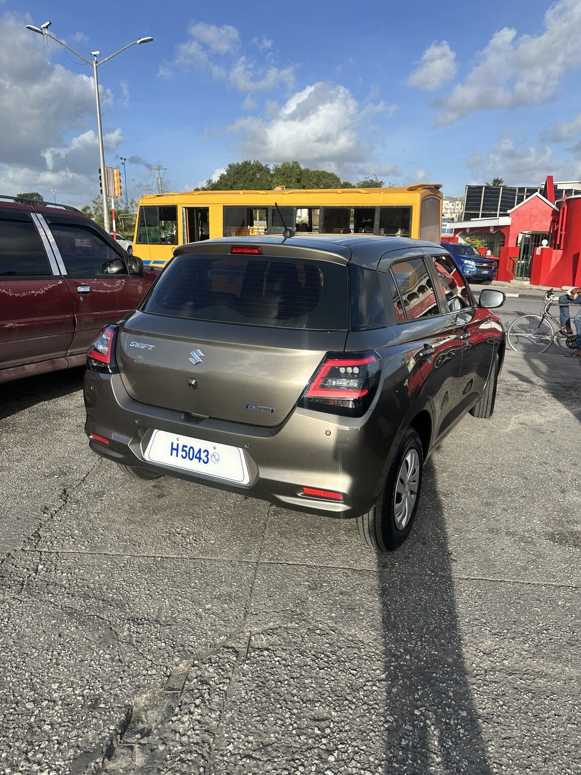 Rear exterior view of the grey Suzuki Swift