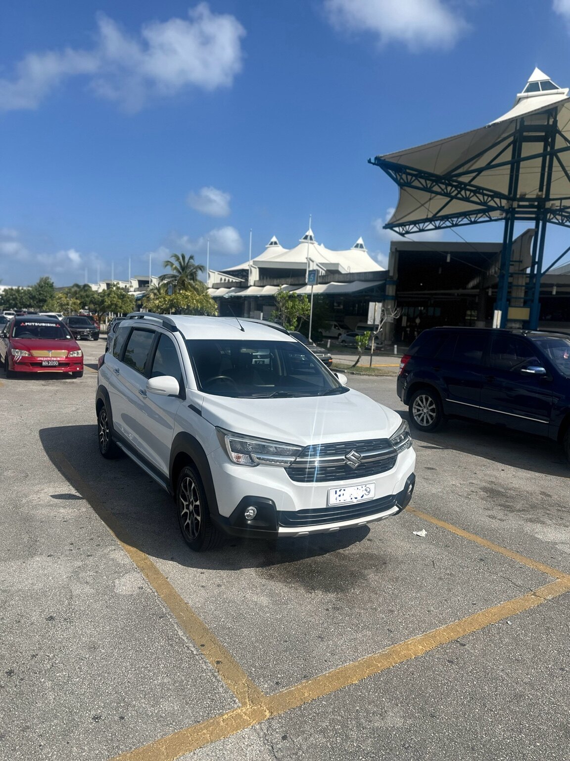 Front view of the white Suzuki XL7